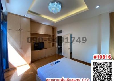 Spacious bedroom with modern furniture and ample lighting