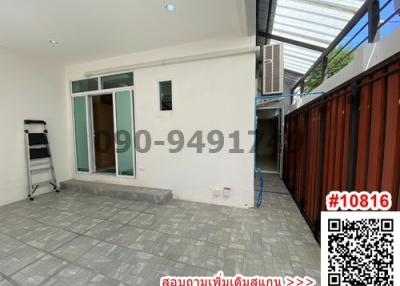 Spacious patio area of a residential home with sliding doors