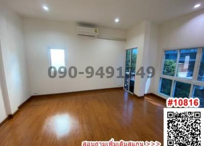 Spacious unfurnished bedroom with hardwood floors and bright windows