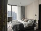 Modern bedroom with large window and city view