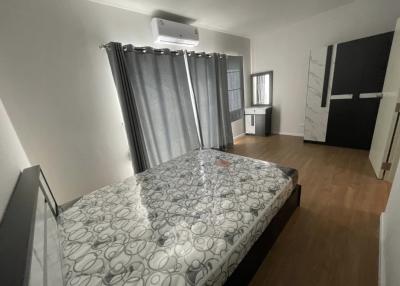 Modern bedroom with large bed and air conditioning