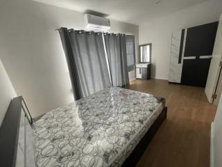 Modern bedroom with large bed and air conditioning