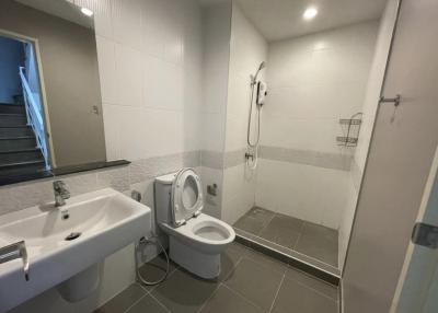 Modern bathroom with white tiles and fixtures