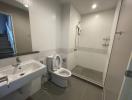 Modern bathroom with white tiles and fixtures