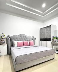 Elegant modern bedroom with a comfortable double bed and stylish lighting