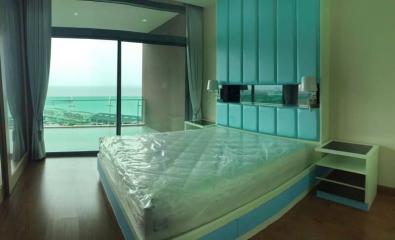 Spacious bedroom with a seaside view and modern design