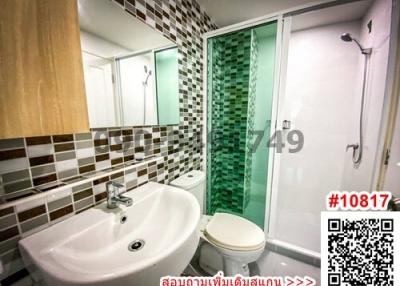 Modern bathroom interior with mosaic tiles and glass shower cubicle