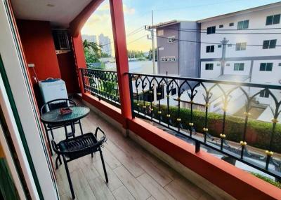 Cozy balcony with outdoor furniture and city view