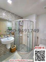 Modern bathroom with walk-in shower and white tiles