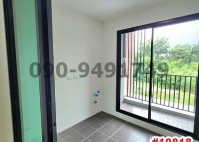 Empty room with large windows and tiled floor