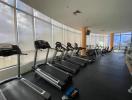 Spacious indoor gym with treadmills and large windows