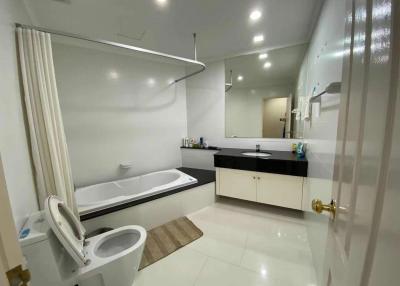 Modern bathroom with bathtub and vanity