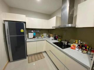 Modern kitchen with stainless steel appliances and white cabinetry