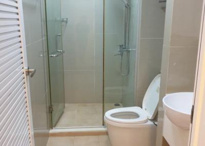 Modern bathroom with walk-in shower and toilet
