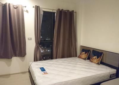 Spacious bedroom with double bed and city view