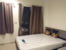 Spacious bedroom with double bed and city view