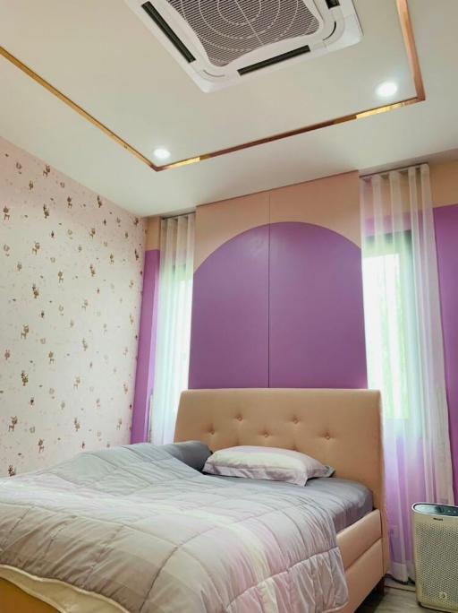 Elegant bedroom with modern design and decorative wallpaper