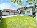 Well-maintained front yard of a suburban home with lush green lawn