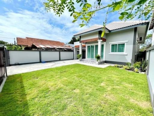 Well-maintained front yard of a suburban home with lush green lawn