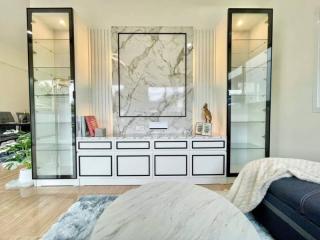 Elegant bedroom interior with marble table and mirrored wardrobe doors