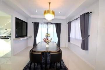 Elegant dining room with chandelier and modern furniture