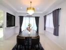 Elegant dining room with chandelier and modern furniture