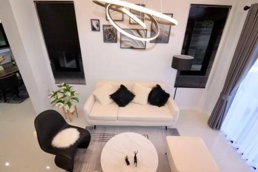 Modern living room with designer furniture and elegant lighting