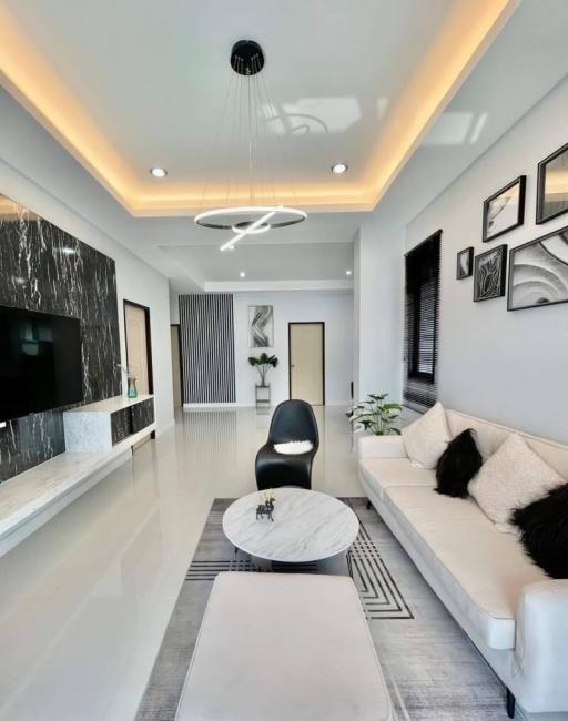 Modern living room with elegant furniture and decorative lighting