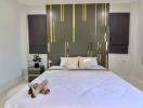 Modern bedroom with decorative golden accents and large bed