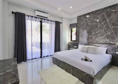 Modern bedroom with marble flooring and elegant decor