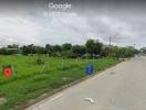 Street view showing potential empty lot for property construction