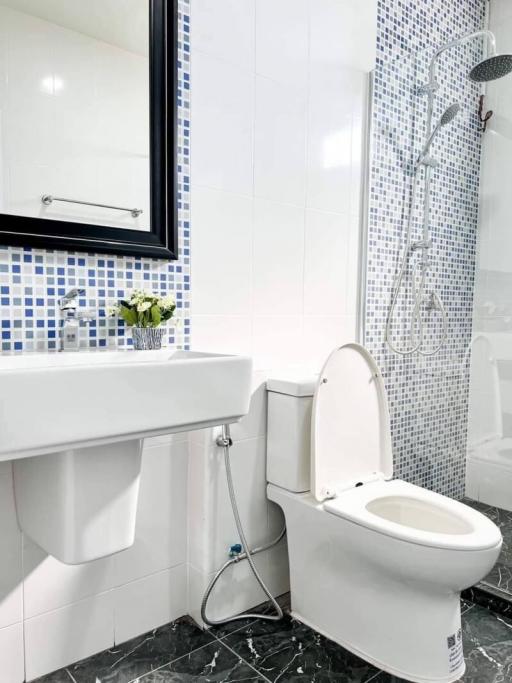 Modern bathroom interior with a toilet and sink