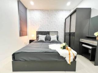 Modern bedroom interior with black bed and stylish decor