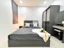 Modern bedroom interior with black bed and stylish decor