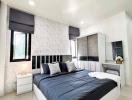 Modern bedroom with a large bed and elegant interior design