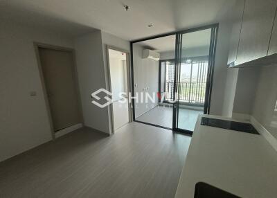 Main living space with kitchen and enclosed balcony