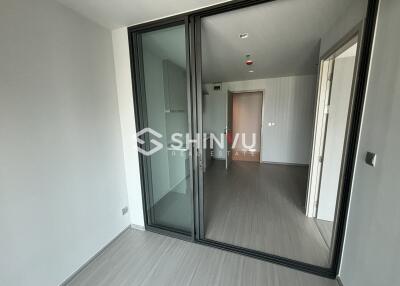 Empty bedroom with sliding glass door