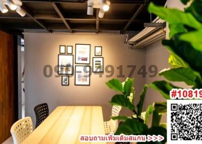 Modern dining area with warm lighting and wall art