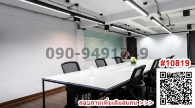Modern meeting room with large table and comfortable chairs