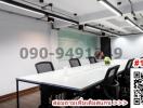 Modern meeting room with large table and comfortable chairs