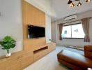 Modern living room with wooden tv cabinet and cozy ambiance