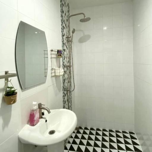 Modern bathroom with black and white tiling