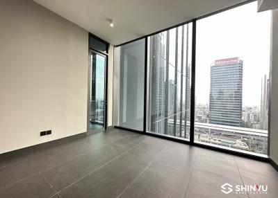 Modern empty apartment interior with large windows and city view
