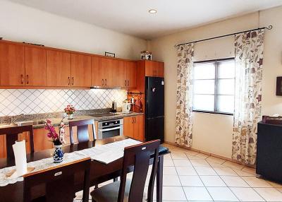 Spacious kitchen with modern appliances and ample cabinetry