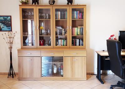 Cozy living room with a wooden bookshelf and workstation