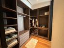 Spacious walk-in closet with custom shelving and storage options