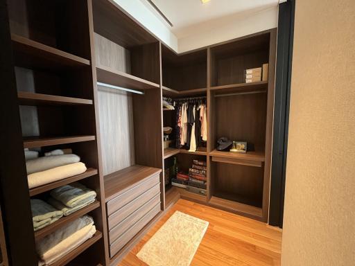 Spacious walk-in closet with custom shelving and storage options