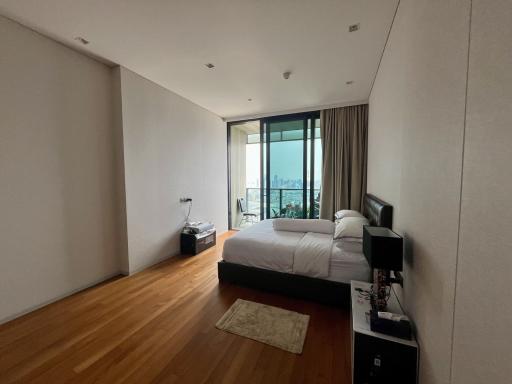 Spacious bedroom with large window and city view