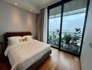 Spacious Bedroom with Floor-to-Ceiling Windows and City View