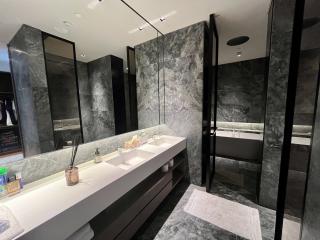 Modern marble bathroom with double vanity and glass shower
